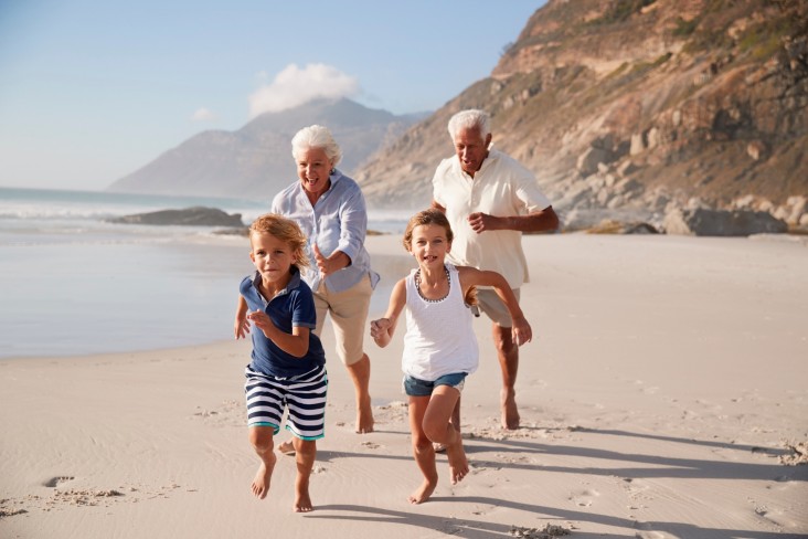 Family run along beach
