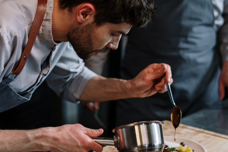 Chef plating a meal